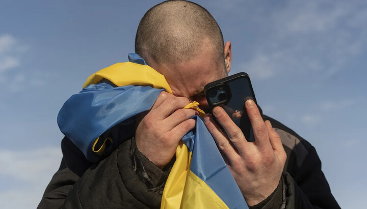 Ukrainian with a flag. Photo: The Associated Press