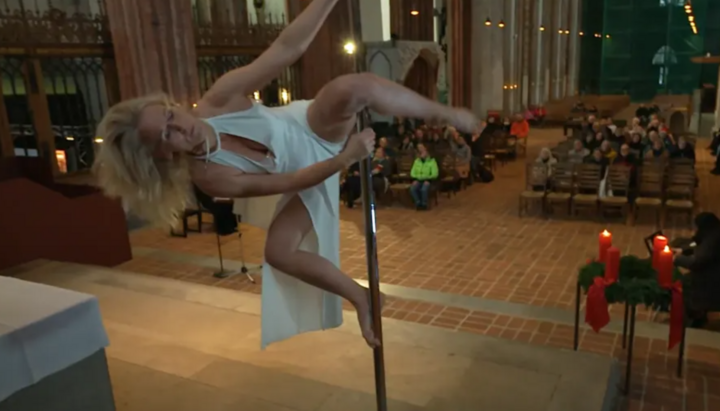 A poledance at St. Mary's Church in Lübeck. Photo: a video screenshot from bild.de