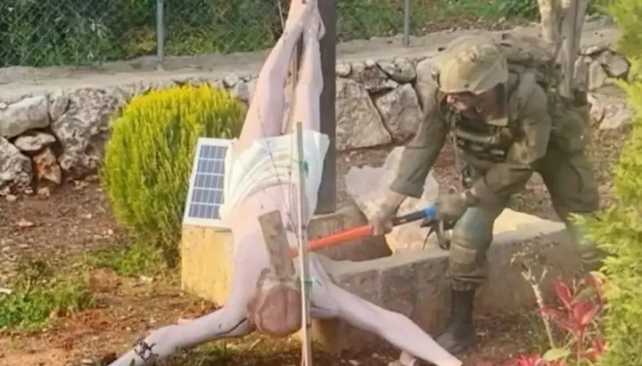 IDF soldier destroys statue of Christ in Lebanon. Photo: open sources