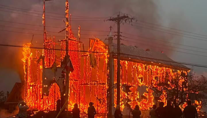 Passersby watch the Saint-Simon Church burning on Monday morning. Photo: CBC News